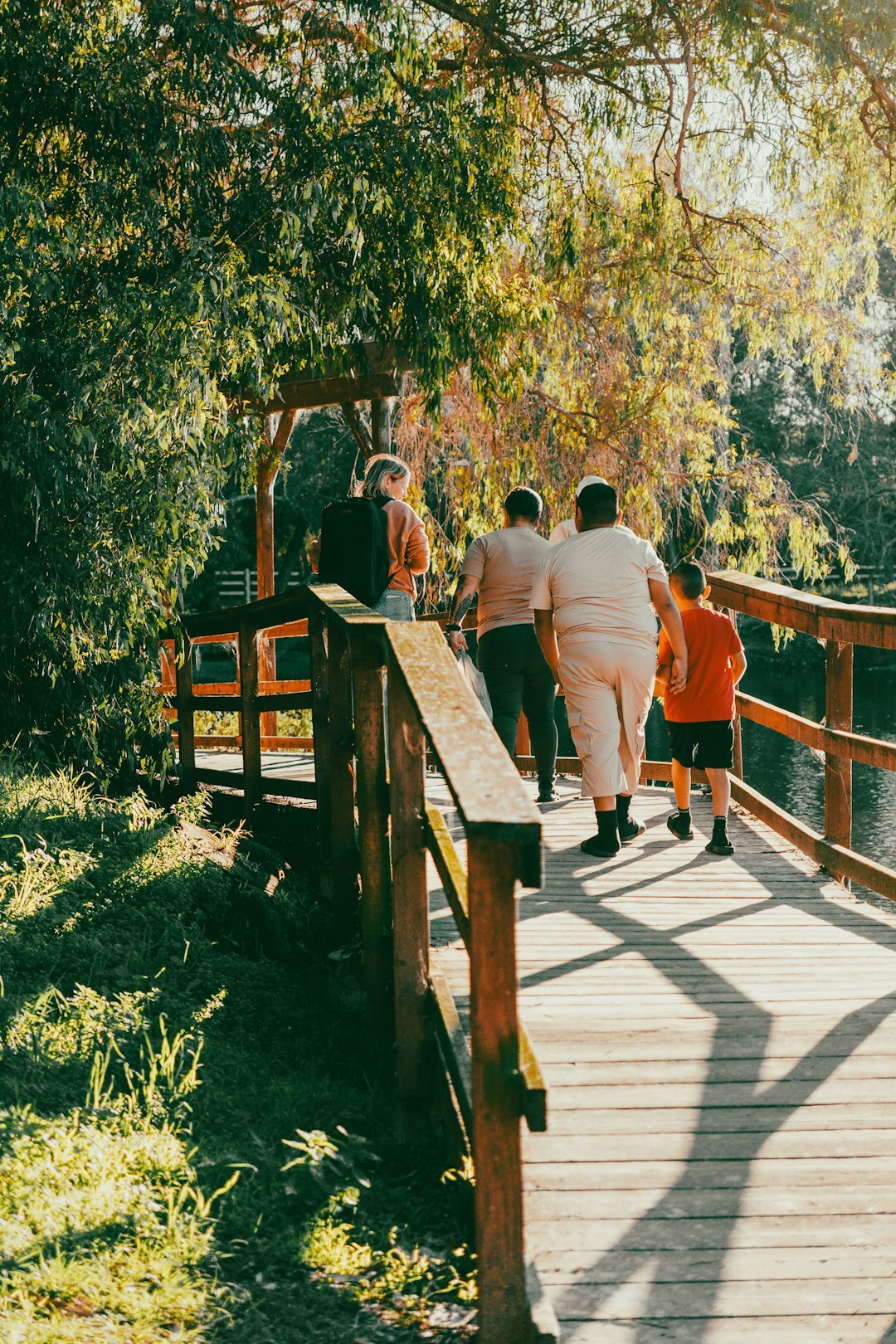 group of seniors walking in autumn park