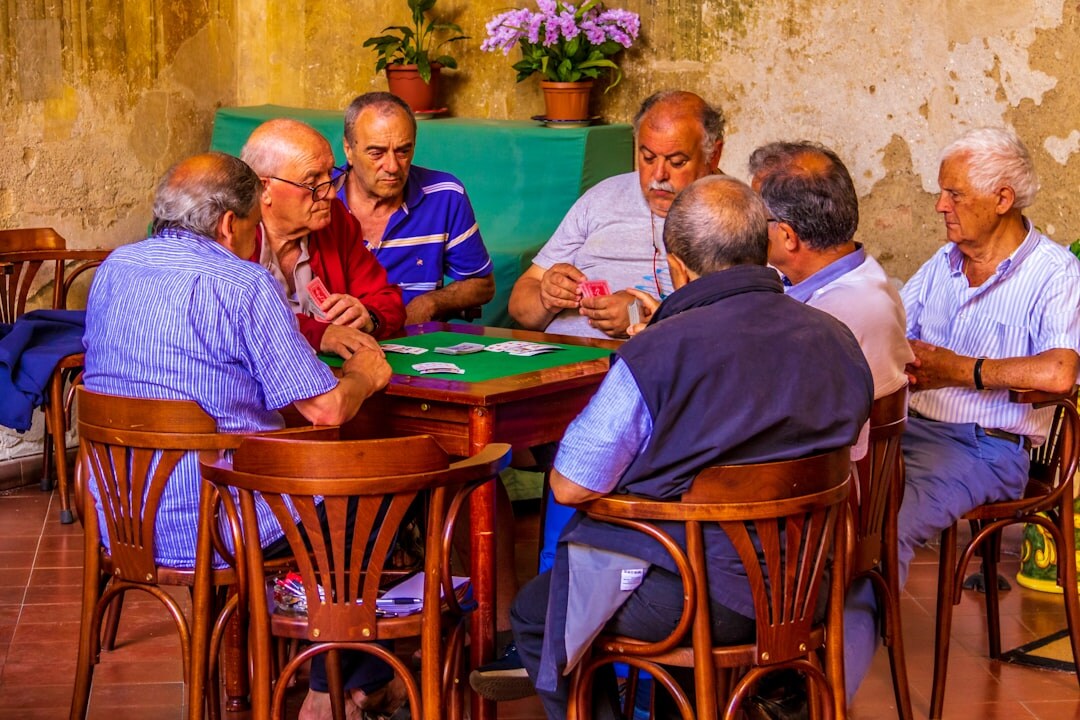 group of seniors playing cards