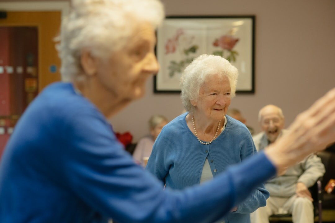 Seniors practicing gentle exercise in a health and wellness class