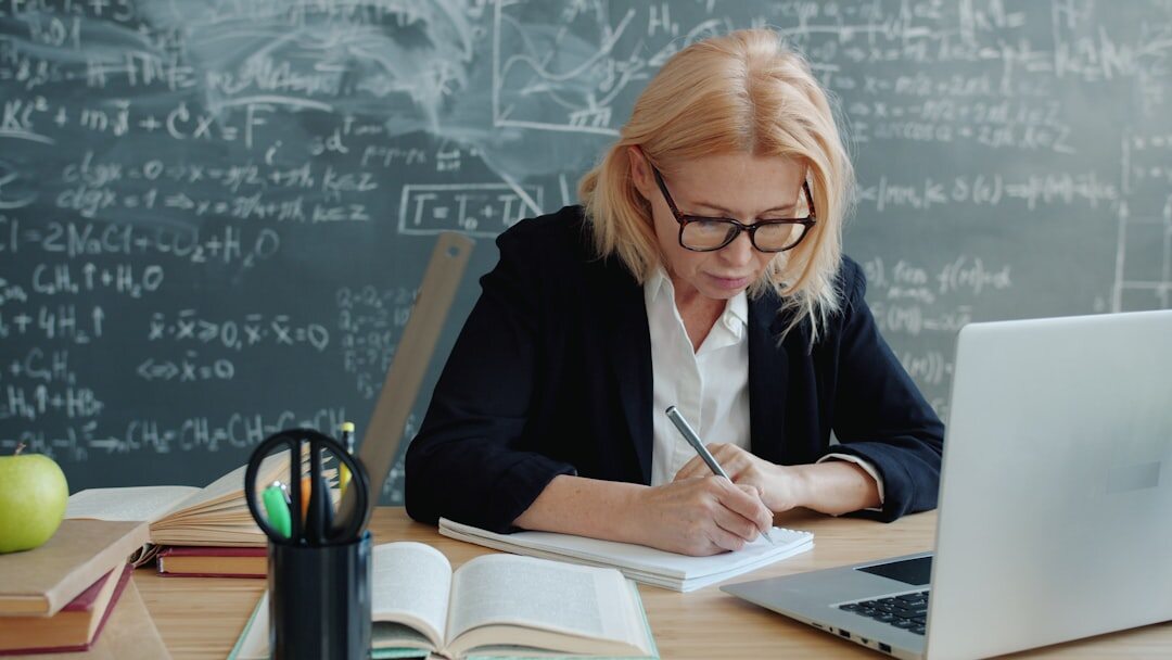 Senior learning basic computer skills in a classroom setting