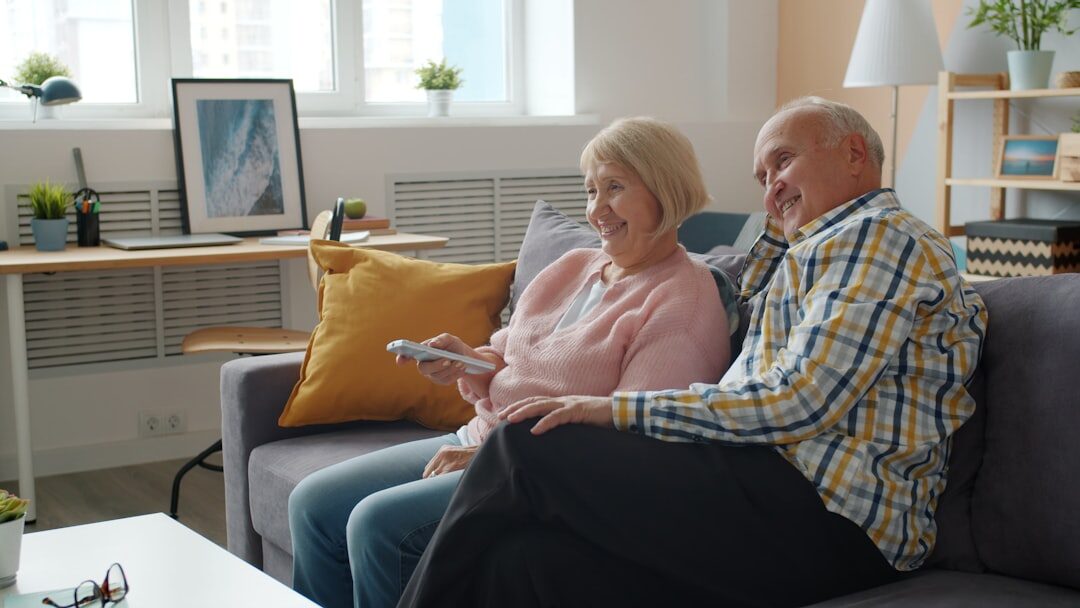 elderly couple budgeting at home