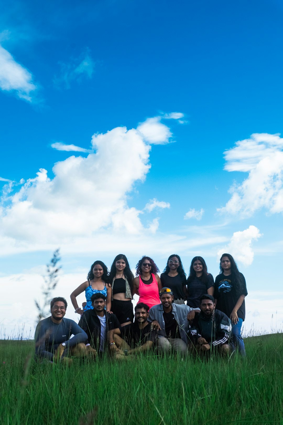 Team of organizers standing together in front of a community centre