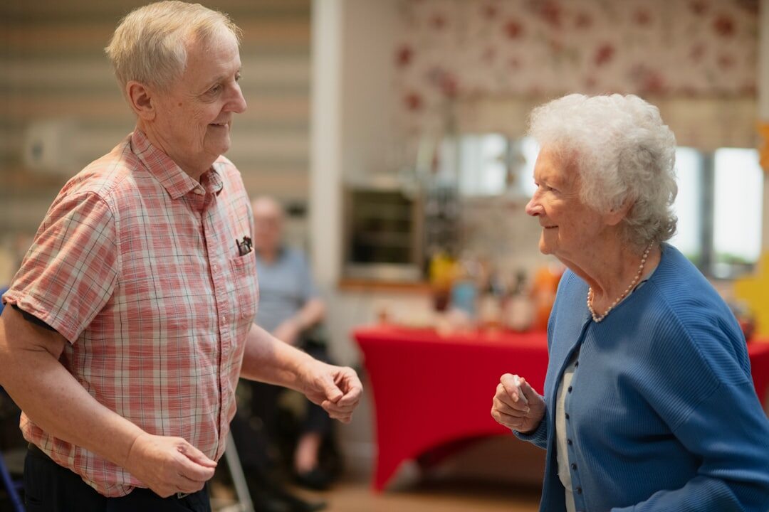 Seniors dancing together at a community social evening